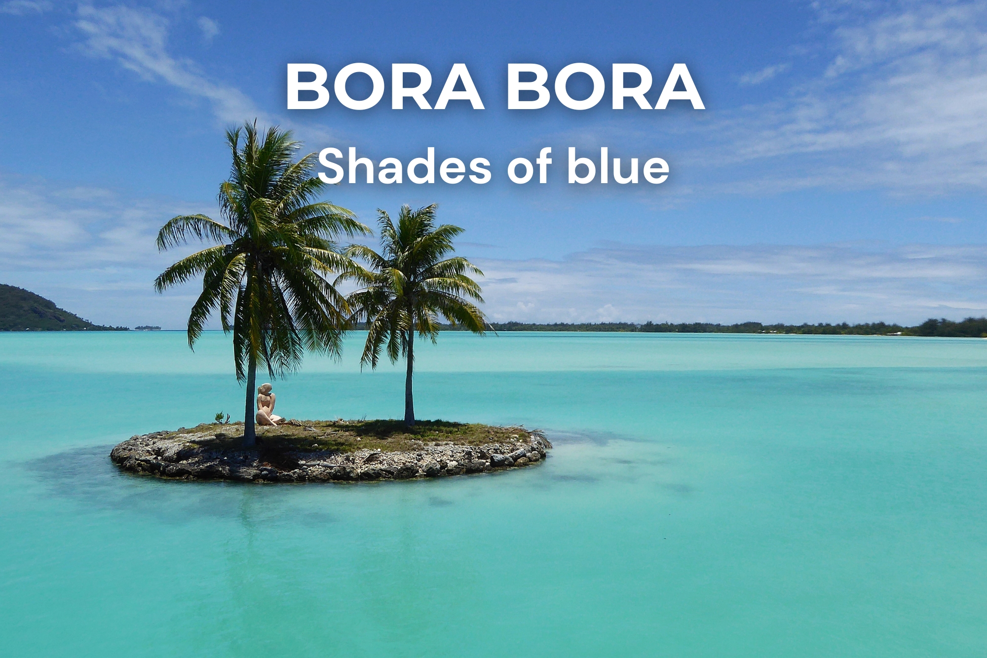 Statue on a small coral islet surrounded by the turquoise lagoon of Bora Bora with its incredible shades of blue, French Polynesia
