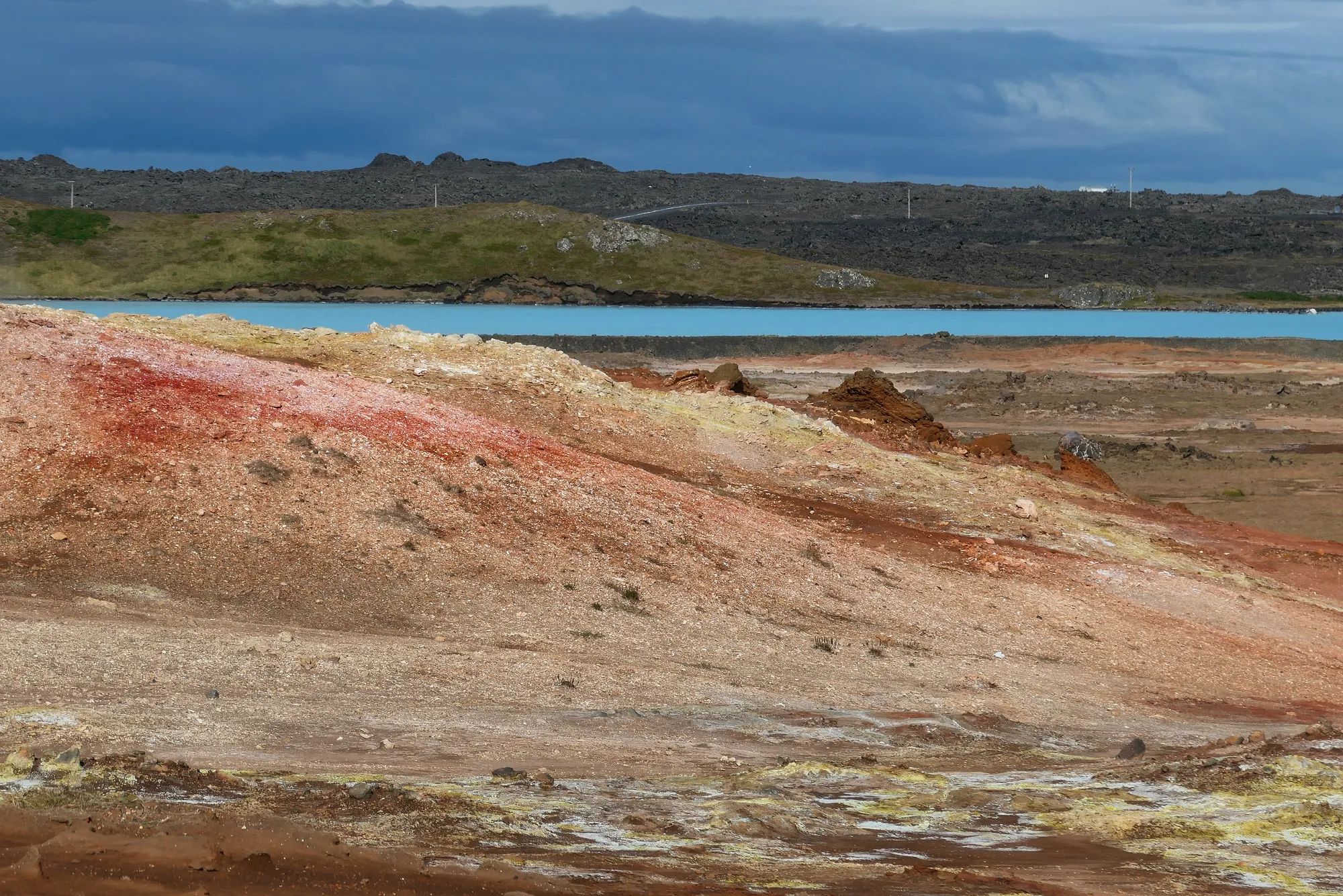 gunnuhver-red-soil-blue-lagoon-view